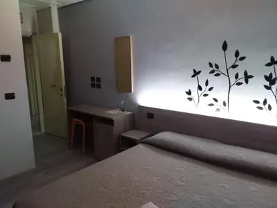 Letto o letti in una camera di Hotel Alle Scuole NEW