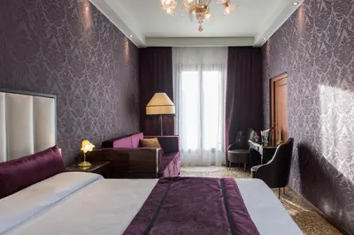 Letto o letti in una camera di Locanda Leon Bianco on the Grand Canal