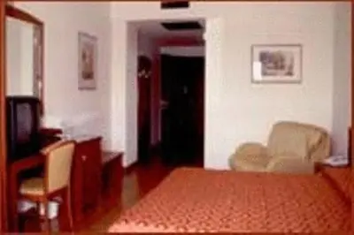 Letto o letti in una camera di Hotel Corone