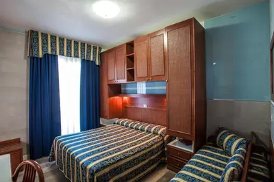 Letto o letti in una camera di Hotel Colombo