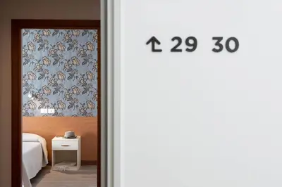 Letto o letti in una camera di Hotel Rosa