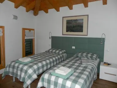 Letto o letti in una camera di da Meri tra le colline del prosecco DOCG locazione turistica