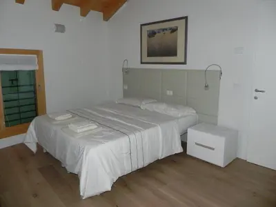 Letto o letti in una camera di da Meri tra le colline del prosecco DOCG locazione turistica
