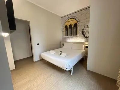 Letto o letti in una camera di B&B Hotel Treviso
