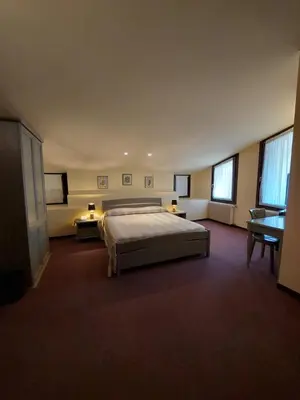 Letto o letti in una camera di Albergo Alla Pineta