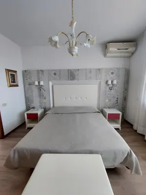 Letto o letti in una camera di Albergo Alla Pineta