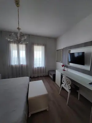 Letto o letti in una camera di Albergo Alla Pineta