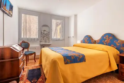 Letto o letti in una camera di Hotel Casa Boccassini