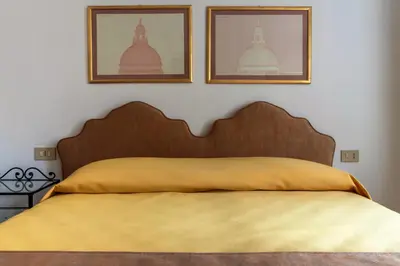 Letto o letti in una camera di Hotel Casa Boccassini