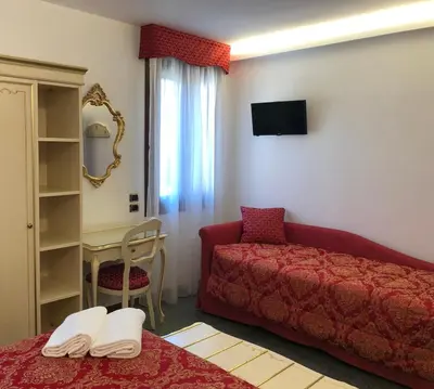 Letto o letti in una camera di Hotel Leonardo