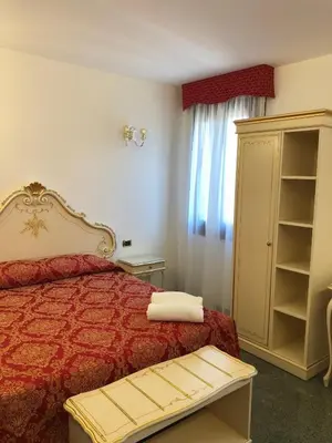 Letto o letti in una camera di Hotel Leonardo