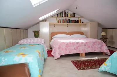 Letto o letti in una camera di B&B Il Glicine Fiorito