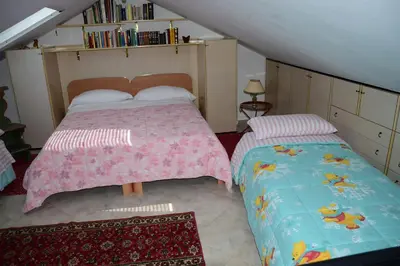Letto o letti in una camera di B&B Il Glicine Fiorito