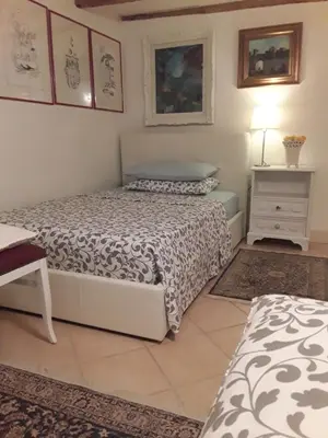Letto o letti in una camera di Locanda Bellavista