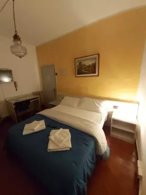 Letto o letti in una camera di Hotel Arcella