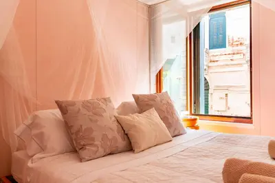 Letto o letti in una camera di Casa Flavia ai Morosini - Luxury apartment with Canal View