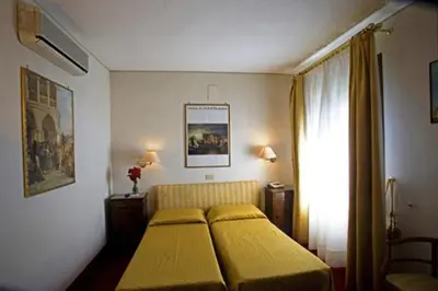 Letto o letti in una camera di Hotel Agli Alboretti