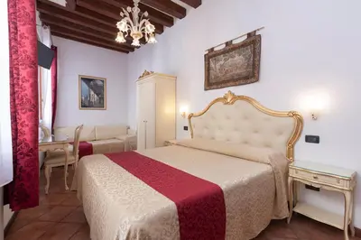Letto o letti in una camera di Alloggi SS Giovanni e Paolo