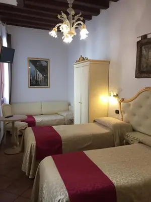 Letto o letti in una camera di Alloggi SS Giovanni e Paolo