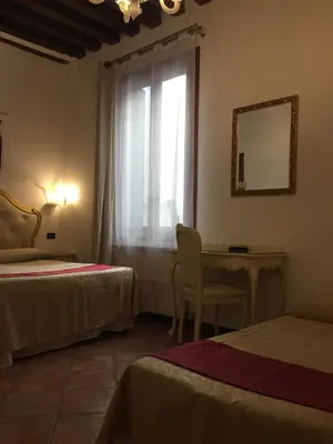 Letto o letti in una camera di Alloggi SS Giovanni e Paolo