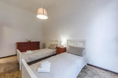 Letto o letti in una camera di Maurizio House - near the Train Station