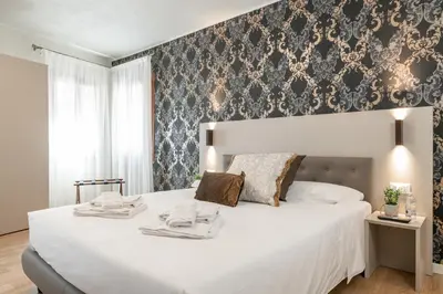 Letto o letti in una camera di Hotel Grifoni