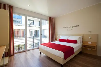 Letto o letti in una camera di UNA Hotels Le Terrazze Treviso Hotel & Residence
