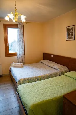 Letto o letti in una camera di Azienda Agrituristica Ai Prai