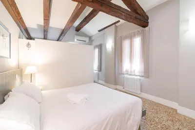 Letto o letti in una camera di VeNICe Cera San Marco Terrace