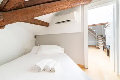 Letto o letti in una camera di VeNICe Cera San Marco Terrace