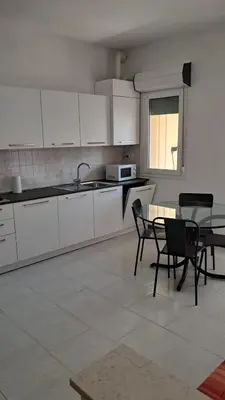 Cucina o angolo cottura di App4rent - VILLA MIMOSA - 3 Family apartments - parking, wifi, near the beach