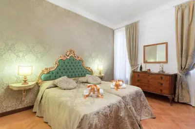 Letto o letti in una camera di Venetian Infinity