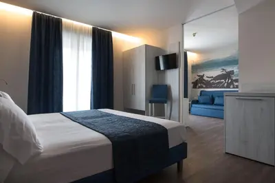 Letto o letti in una camera di Hotel Cesare Augustus
