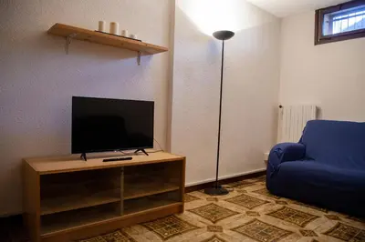 TV o dispositivi per l'intrattenimento presso Ca' Bianca Relax Apartment