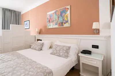 Letto o letti in una camera di Park Hotel Cellini