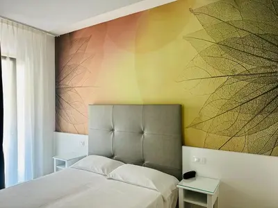 Letto o letti in una camera di Hotel President