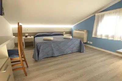 Letto o letti in una camera di Hotel Serenella