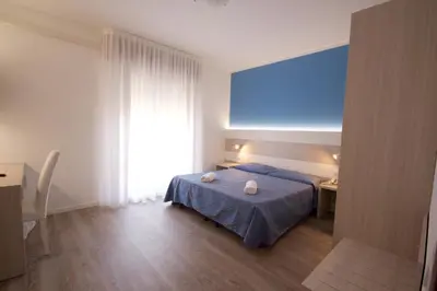 Letto o letti in una camera di Hotel Serenella