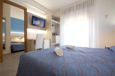 Letto o letti in una camera di Hotel Serenella
