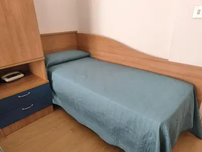 Letto o letti in una camera di Hotel Midi