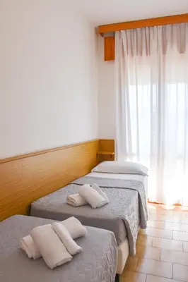 Letto o letti in una camera di Hotel Umberto