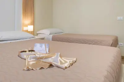 Letto o letti in una camera di Hotel Suez