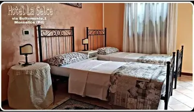 Letto o letti in una camera di Hotel La Selce