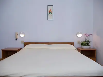 Letto o letti in una camera di Hotel Casa Mia