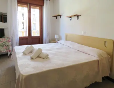 Letto o letti in una camera di Hotel Saturno