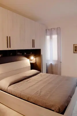 Letto o letti in una camera di CORTE Apartment