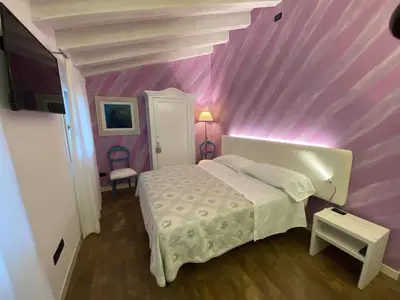 Letto o letti in una camera di Le Fate Corbezzole