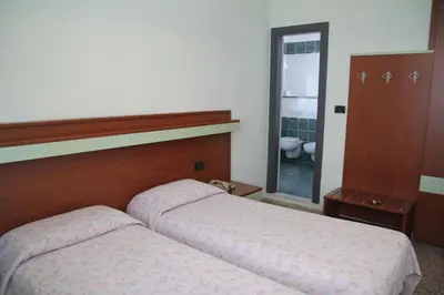 Letto o letti in una camera di Hotel Palm Beach
