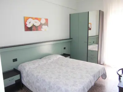 Letto o letti in una camera di Hotel Palm Beach