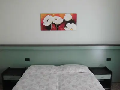 Letto o letti in una camera di Hotel Palm Beach